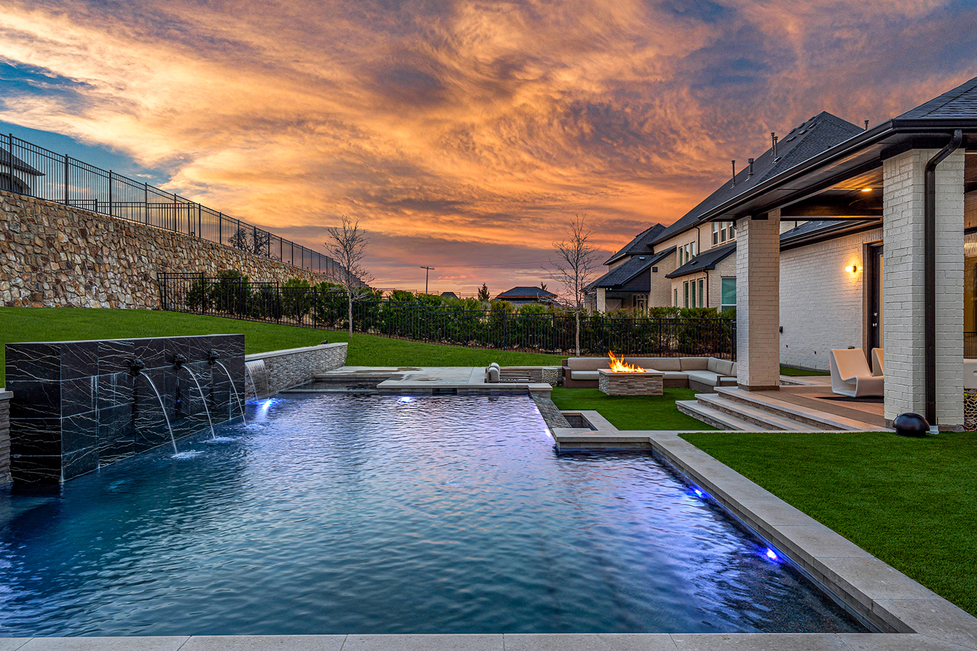 a pool at sunset - dallas pool company