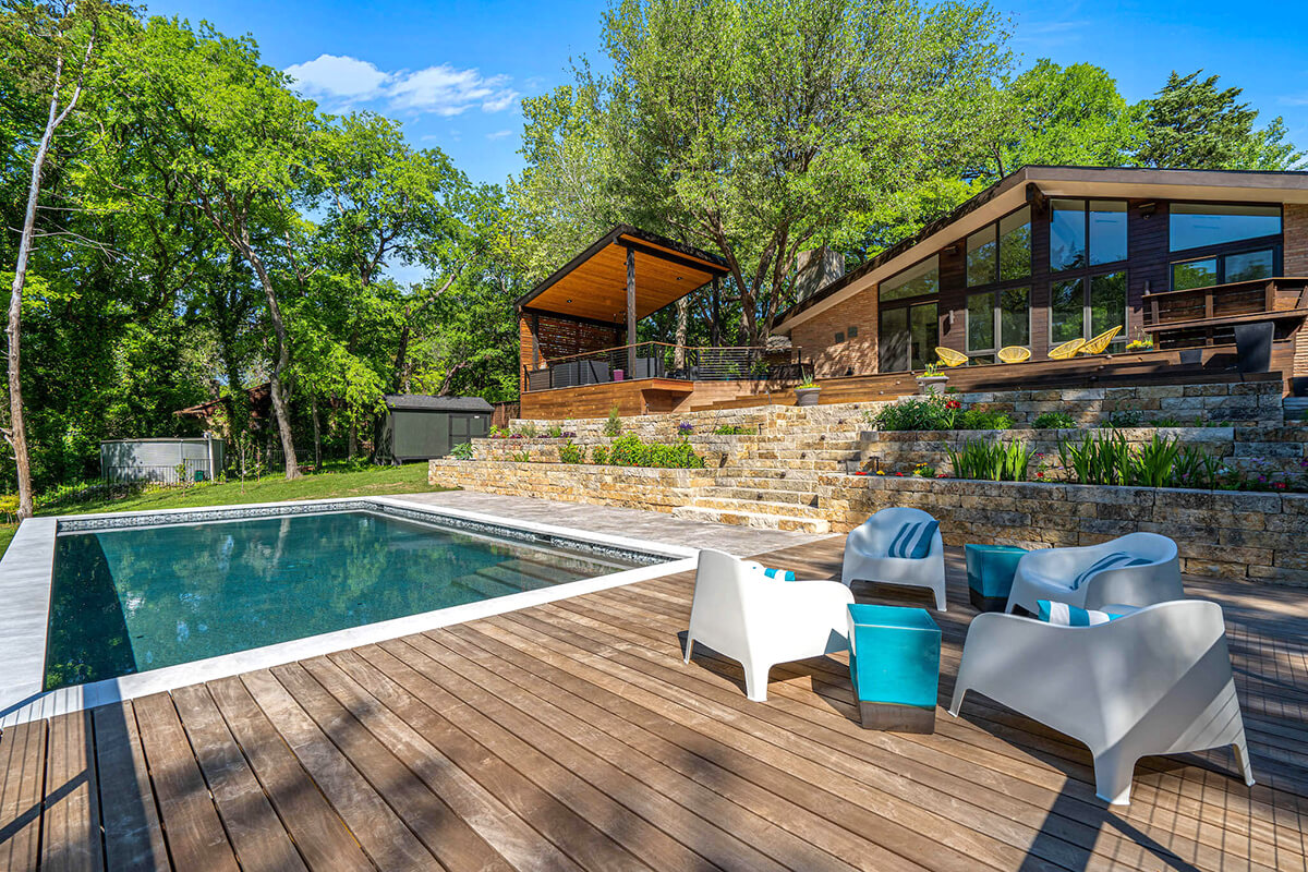 an outdoor living space and pool in Dallas