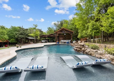 a freeform pool with custom features in Anna Texas